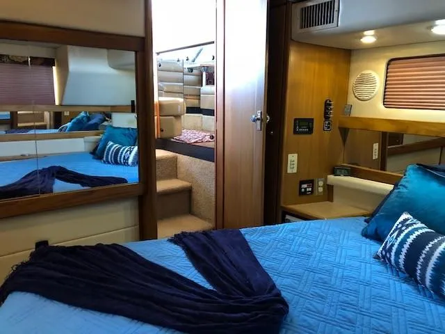 Slide: The Image of Interior of 2000 Bayliner 4087 Aft Cabin Motoryacht with cozy bedroom and elegant decor. - 24