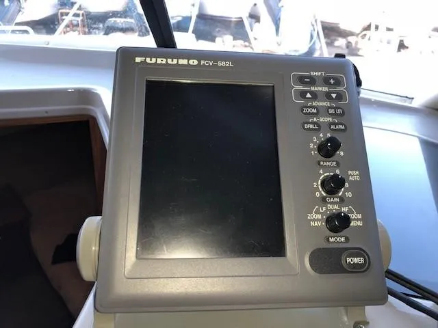 Slide: The Image of Furuno FCV-582L fish finder on 2000 Bayliner 4087 Aft Cabin Motoryacht dashboard. - 31