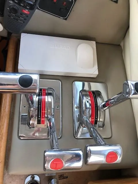 Slide: The Image of Control panel of a 2000 Bayliner 4087 Aft Cabin Motoryacht with dual throttle levers. - 35