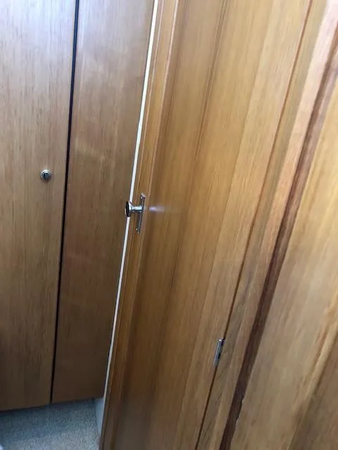 Slide: The Image of Wooden interior of 2000 Bayliner 4087 Aft Cabin Motoryacht, featuring cabin doors. - 36