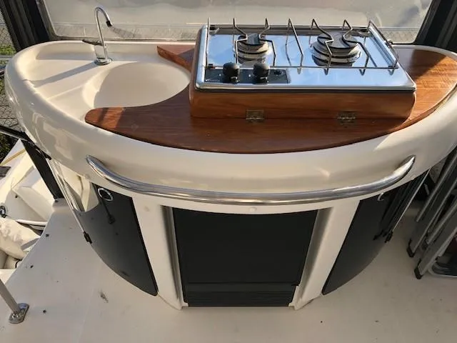 Slide: The Image of 2000 Bayliner 4087 Aft Cabin Motoryacht kitchen with stove and sink. - 4