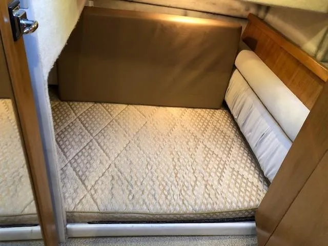 Slide: The Image of Cozy cabin interior of 2000 Bayliner 4087 Aft Cabin Motoryacht with quilted bedding. - 43