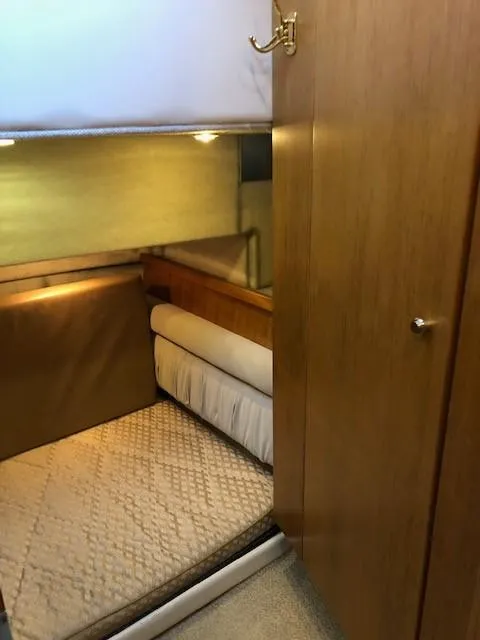 Slide: The Image of 2000 Bayliner 4087 Aft Cabin Motoryacht interior with cozy bed and wooden cabinetry. - 45