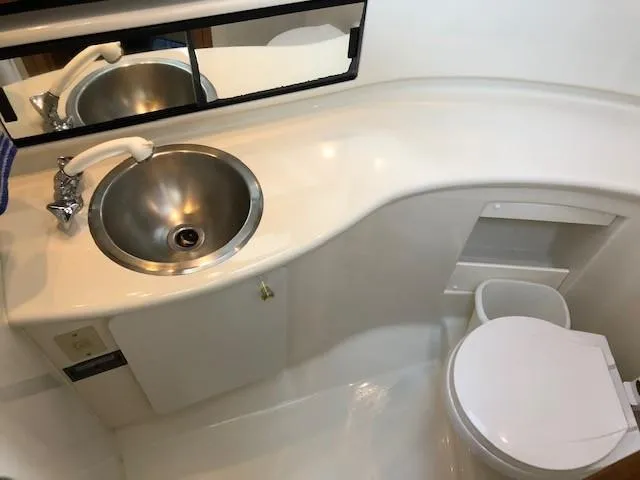 Slide: The Image of Bayliner 4087 Aft Cabin Motoryacht 2000 bathroom with sink and toilet. - 46