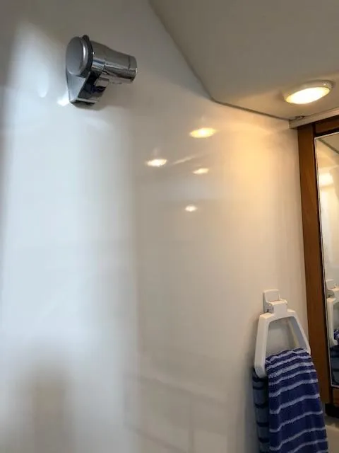 Slide: The Image of Bathroom interior of 2000 Bayliner 4087 Aft Cabin Motoryacht with towel and light fixture. - 49