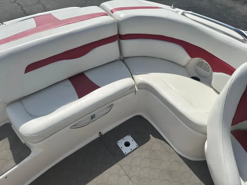Slide: The Image of 2002 Chaparral 220WT SSi boat interior with white and red seating. - 10