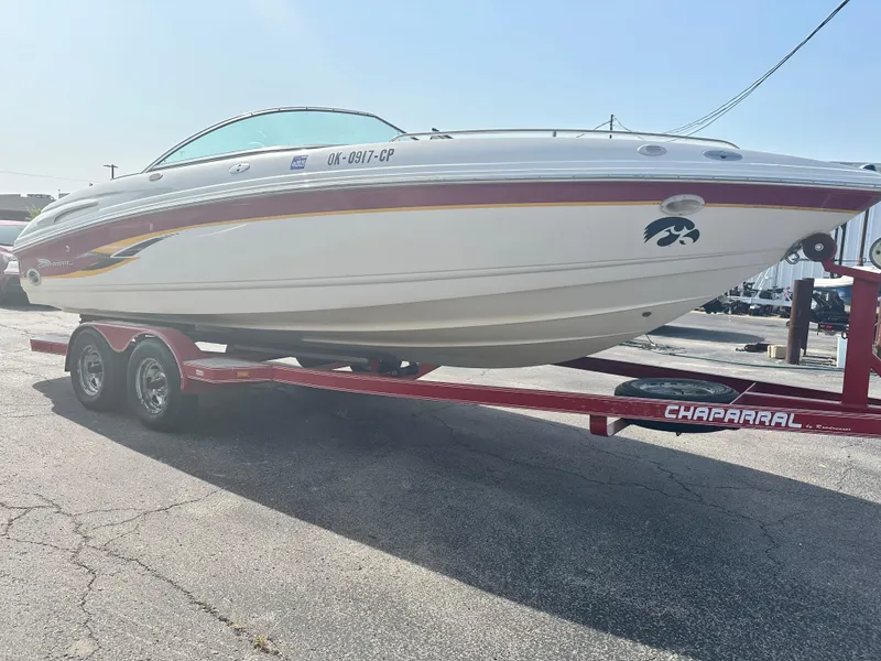Slide: The Image of 2002 Chaparral 220WT SSi boat on red trailer in sunny outdoor setting. - 4