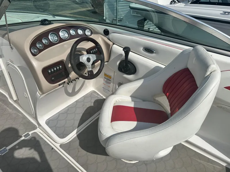 Slide: The Image of 2002 Chaparral 220WT SSi boat interior with steering wheel and captain's seat. - 7