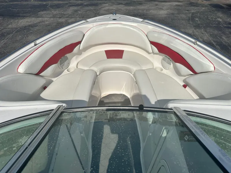 Slide: The Image of 2002 Chaparral 220WT SSi boat interior with white and red seating. - 8