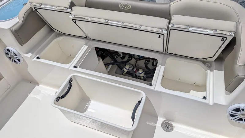 Slide: The Image of 2025 Key West 263 FS boat interior with storage compartments and seating. - 11