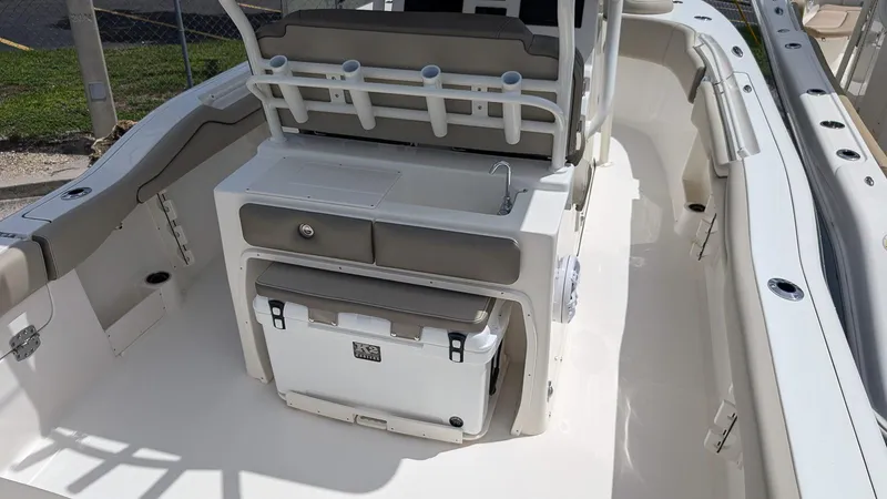 Slide: The Image of 2025 Key West 263 FS boat interior with seating and storage compartments. - 12