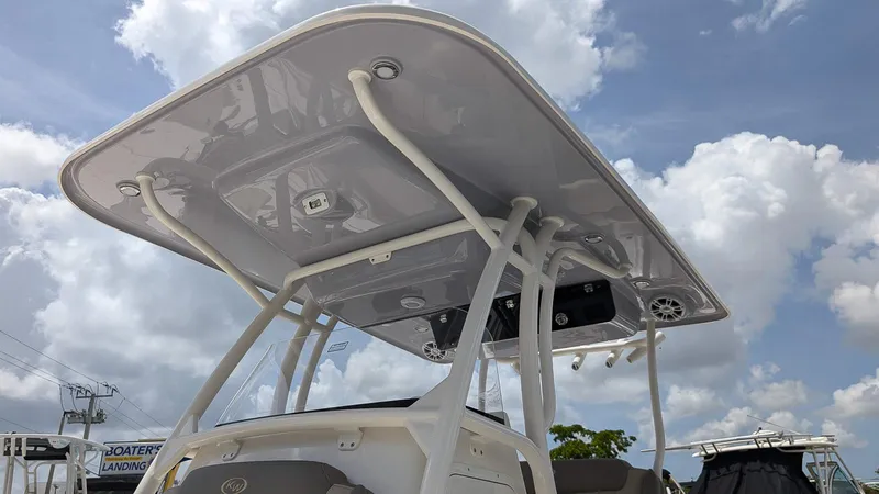 Slide: The Image of 2025 Key West 263 FS boat with T-top under a cloudy sky. - 25