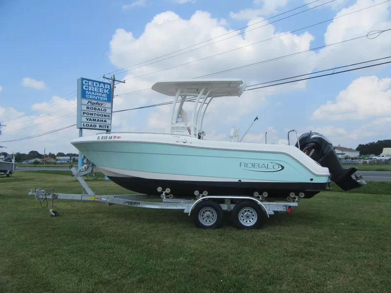 Slide: The Image of 2022 Robalo R222 Center Console boat on trailer at Cedar Creek Marina. - 1