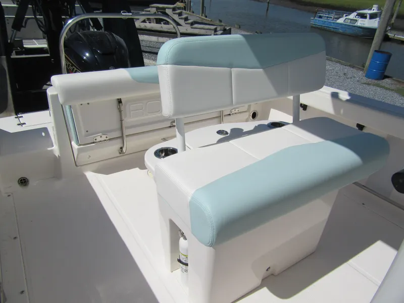 Slide: The Image of 2022 Robalo R222 Center Console boat seating area with light blue and white upholstery. - 3