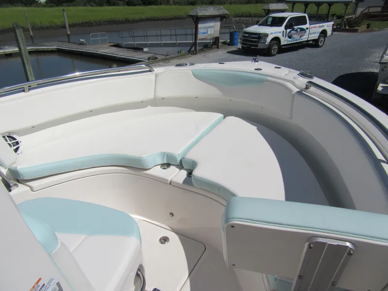 Slide: The Image of 2022 Robalo R222 Center Console boat with spacious seating area. - 8
