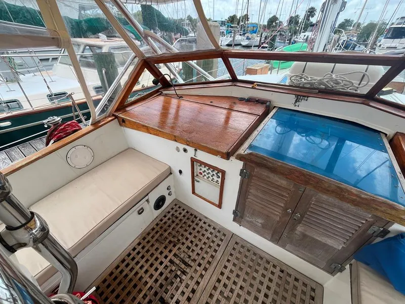 Slide: The Image of 1975 Cheoy Lee Offshore 53 MS cockpit with wooden accents and seating. - 11