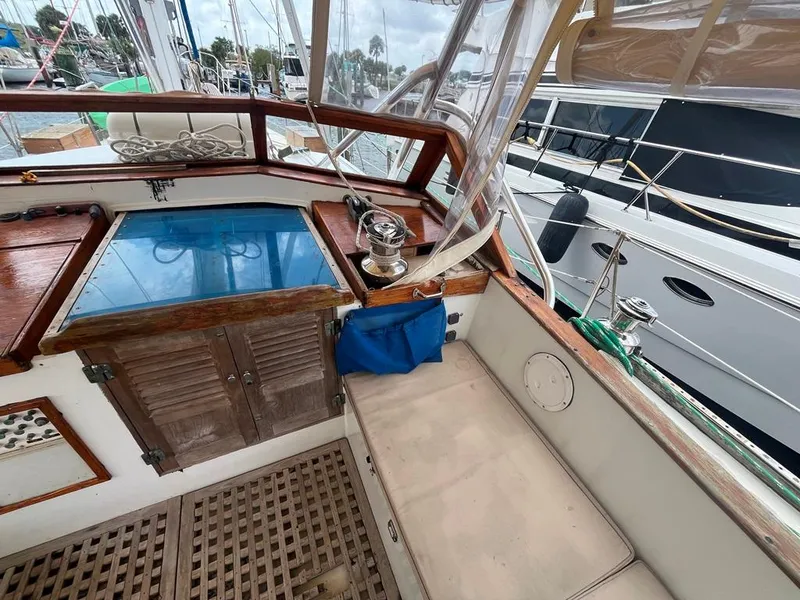 Slide: The Image of 1975 Cheoy Lee Offshore 53 MS cockpit with wooden accents and seating area. - 12