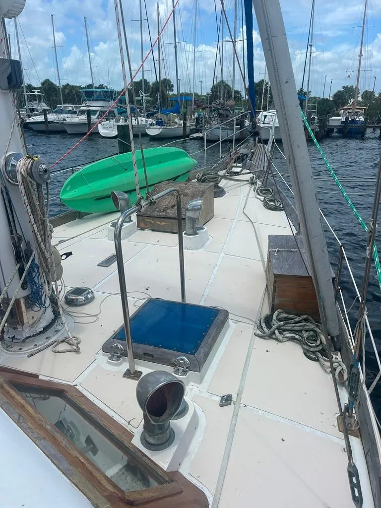 Slide: The Image of 1975 Cheoy Lee Offshore 53 MS sailboat deck with marina view. - 13