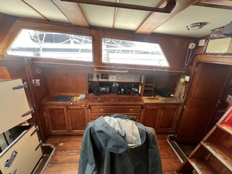Slide: The Image of Interior of 1975 Cheoy Lee Offshore 53 MS sailboat with wooden cabinetry and navigation equipment. - 20