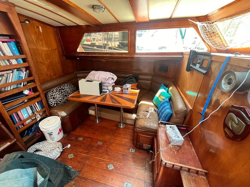 Slide: The Image of 1975 Cheoy Lee Offshore 53 MS yacht interior with wood paneling and cozy seating area. - 26