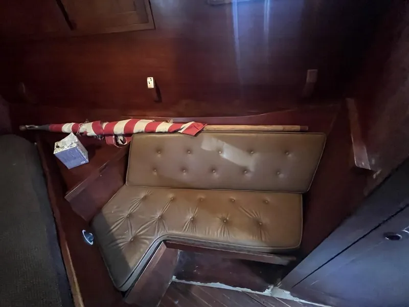 Slide: The Image of 1975 Cheoy Lee Offshore 53 MS interior with brown leather seating and wooden paneling. - 29