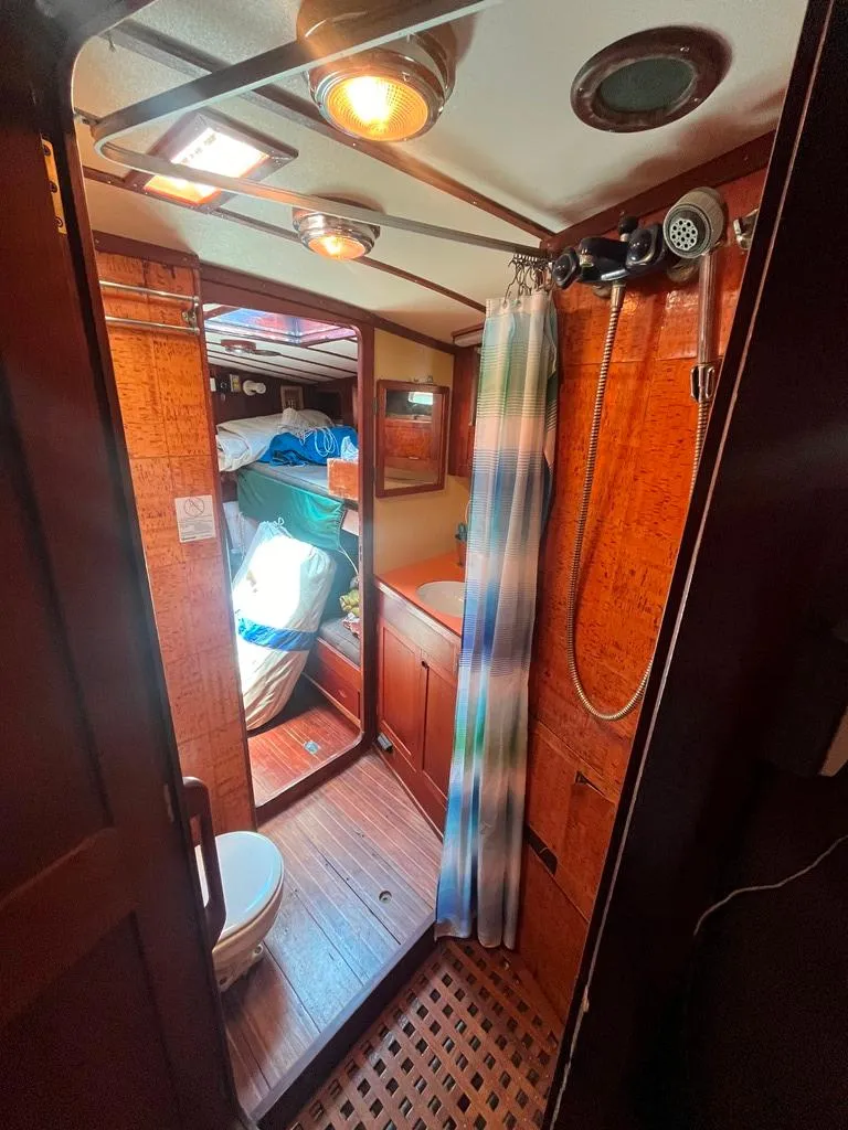 Slide: The Image of 1975 Cheoy Lee Offshore 53 MS yacht bathroom with shower and wooden interior. - 30