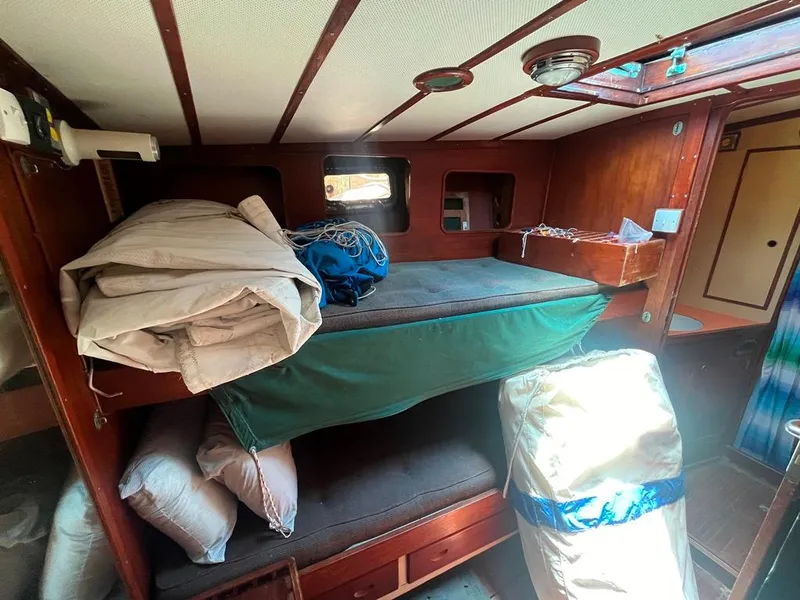 Slide: The Image of Interior cabin of 1975 Cheoy Lee Offshore 53 MS sailboat with bunks and storage. - 32