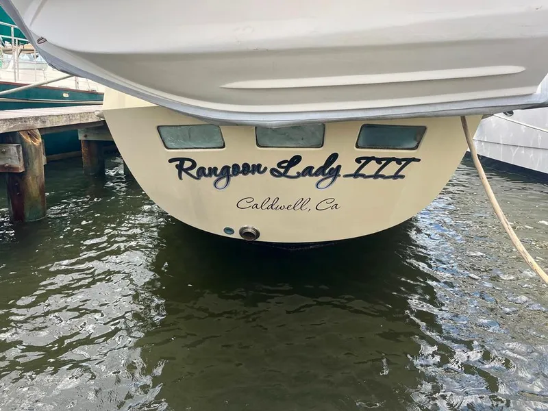 Slide: The Image of 1975 Cheoy Lee Offshore 53 MS yacht, stern view with "Rangoon Lady III" name. - 4