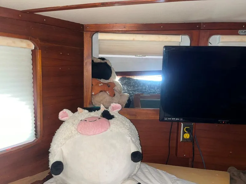 Slide: The Image of Plush cow toy and TV inside 1975 Cheoy Lee Offshore 53 MS yacht cabin. - 40