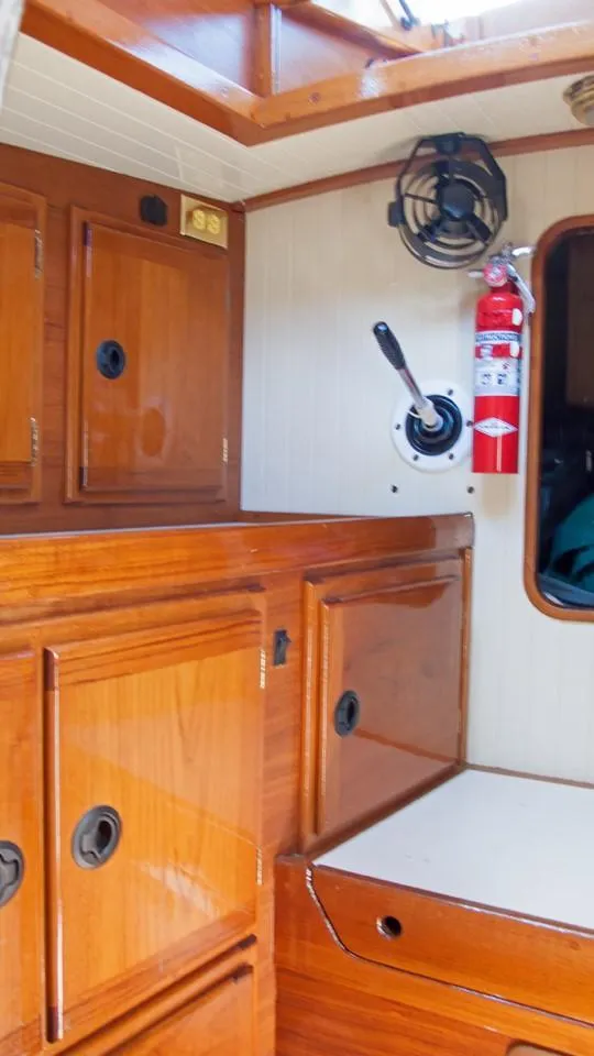 Slide: The Image of Interior of 2003 Bristol Channel Cutter Samuel Morse with wooden cabinetry and safety equipment. - 15