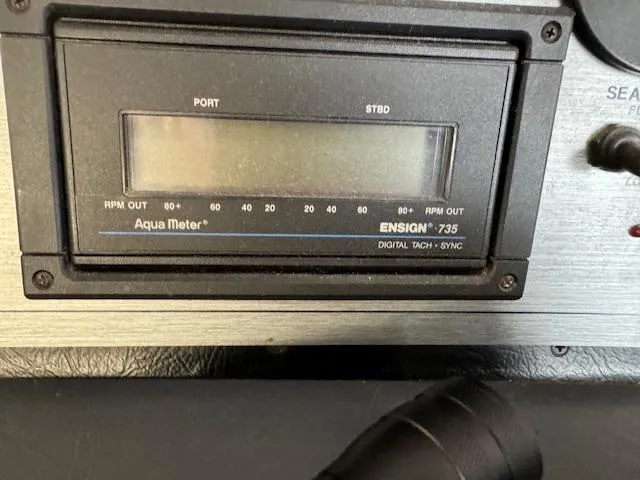 Slide: The Image of Aqua Meter Ensign 735 digital tachometer on Gibson 44 Standard, 1994 model. - 12