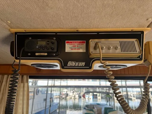 Slide: The Image of 1994 Gibson 44 Standard boat radio system with dual microphones and speakers. - 16
