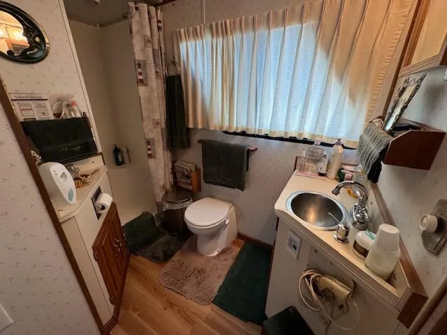 Slide: The Image of Compact bathroom with shower, sink, and toilet in a 1994 Gibson 44 Standard. - 36