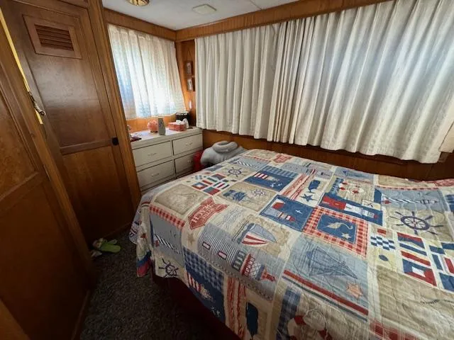 Slide: The Image of Cozy bedroom in 1994 Gibson 44 Standard boat with nautical-themed quilt. - 42