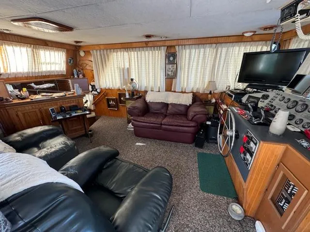 Slide: The Image of Cozy 1994 Gibson 44 Standard boat interior with leather seating and control panel. - 6