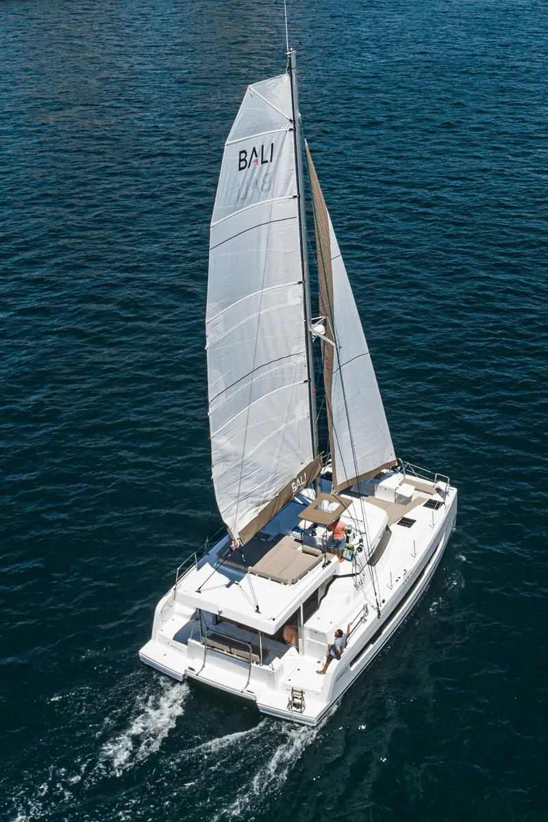 Slide: The Image of 2025 Bali CATSPACE sailing catamaran cruising on open water. - 14