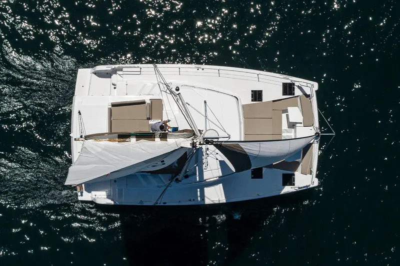Slide: The Image of Aerial view of 2025 Bali CATSPACE catamaran sailing on sparkling water. - 19