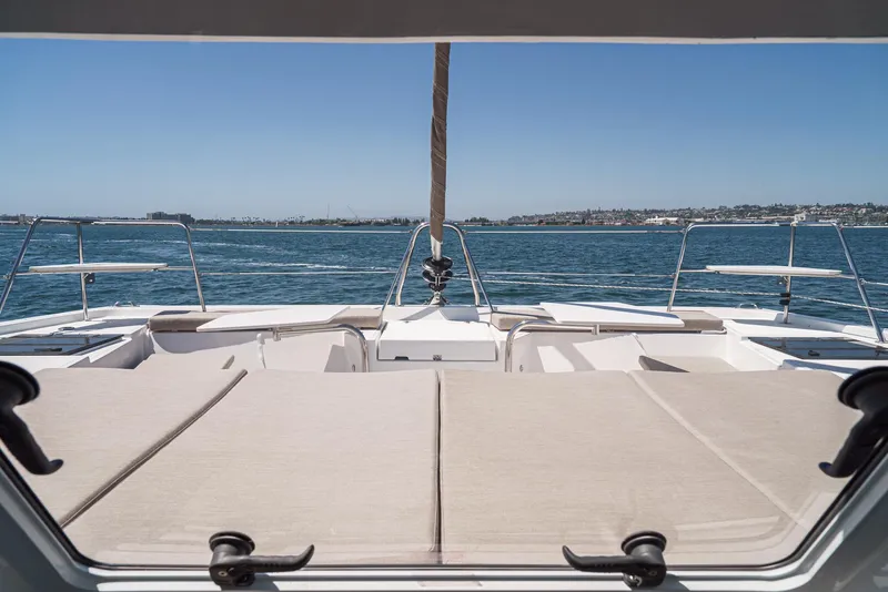 Slide: The Image of Bali CATSPACE 2025 catamaran deck with ocean view and clear blue sky. - 22