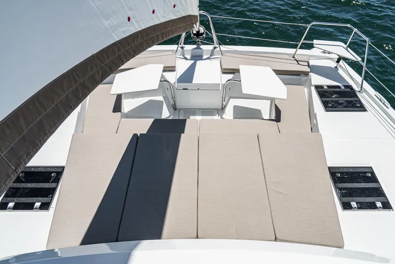 Slide: The Image of Luxurious 2025 Bali CATSPACE yacht deck with sun loungers and seating area. - 23