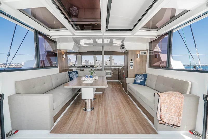 Slide: The Image of Luxurious 2025 Bali CATSPACE yacht interior with modern seating and panoramic windows. - 34