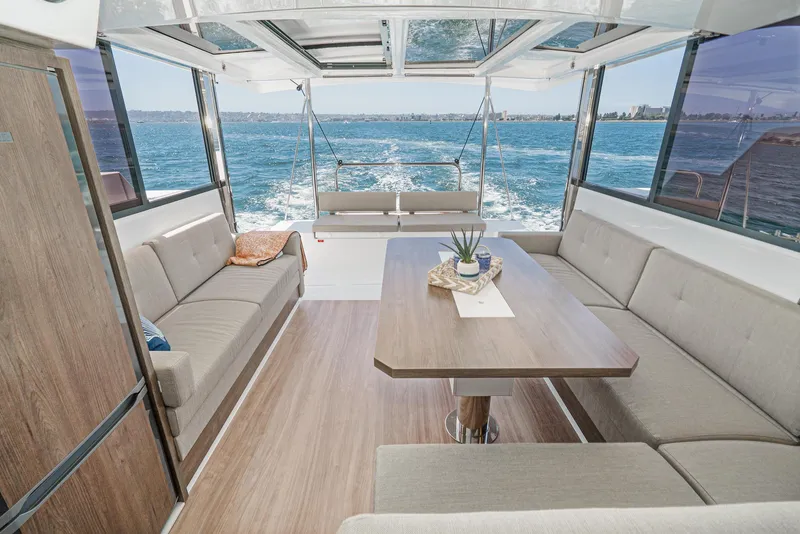 Slide: The Image of Luxurious 2025 Bali CATSPACE yacht interior with ocean view and elegant seating area. - 37