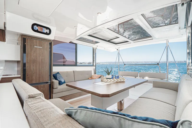 Slide: The Image of Luxurious interior of 2025 Bali CATSPACE catamaran with ocean view and modern furnishings. - 38