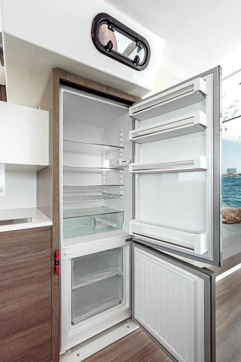 Slide: The Image of Open refrigerator in 2025 Bali CATSPACE yacht kitchen interior. - 39