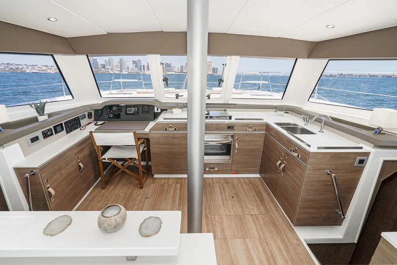 Slide: The Image of Modern Bali CATSPACE 2025 yacht interior with panoramic windows and sleek kitchen design. - 40