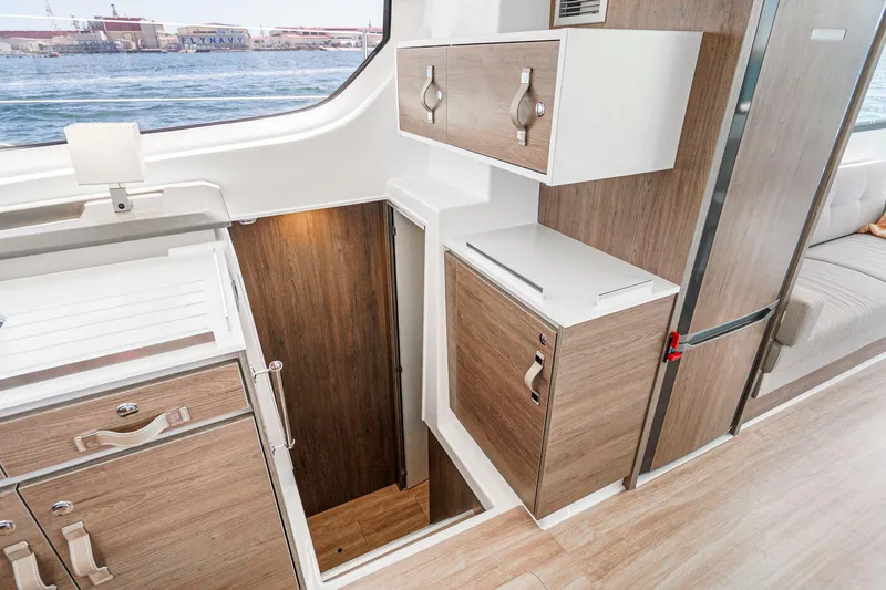 Slide: The Image of Modern interior of 2025 Bali CATSPACE catamaran with wood cabinetry and ocean view. - 46