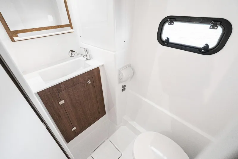 Slide: The Image of Modern bathroom in 2025 Bali CATSPACE yacht with sink, toilet, and window. - 49