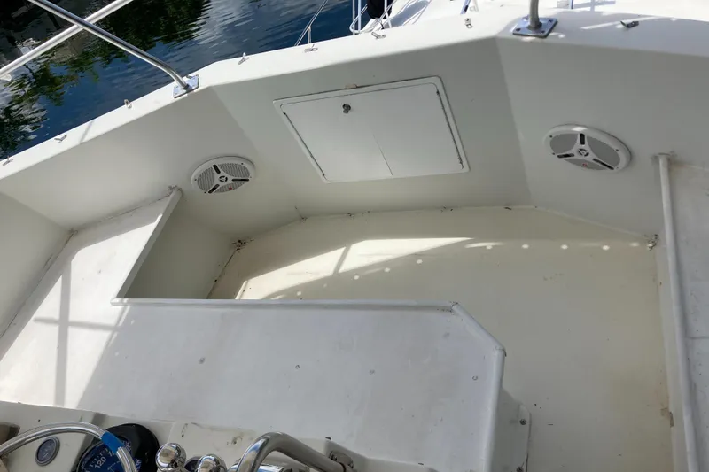 Slide: The Image of 1976 Hatteras 46 boat deck with storage hatch and speakers. - 12