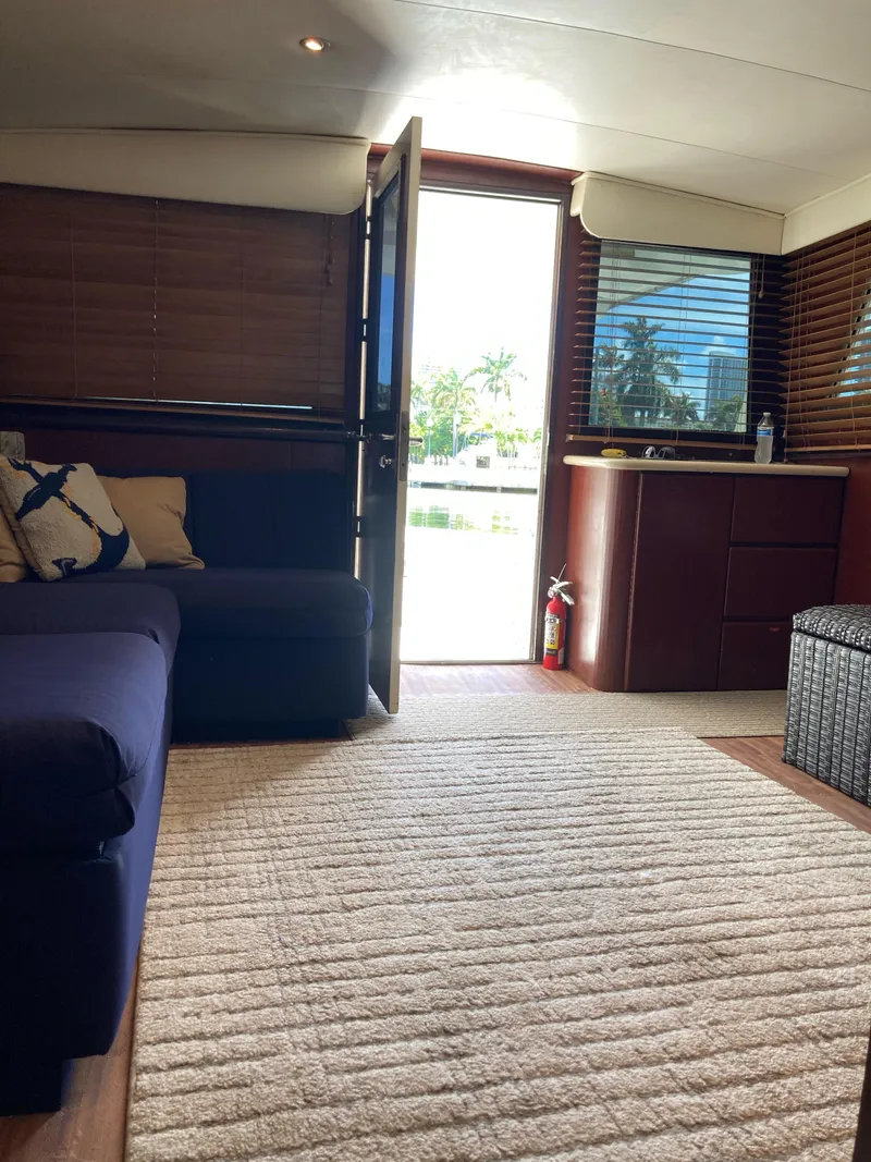 Slide: The Image of Interior of 1976 Hatteras 46 yacht with cozy seating and natural light. - 29