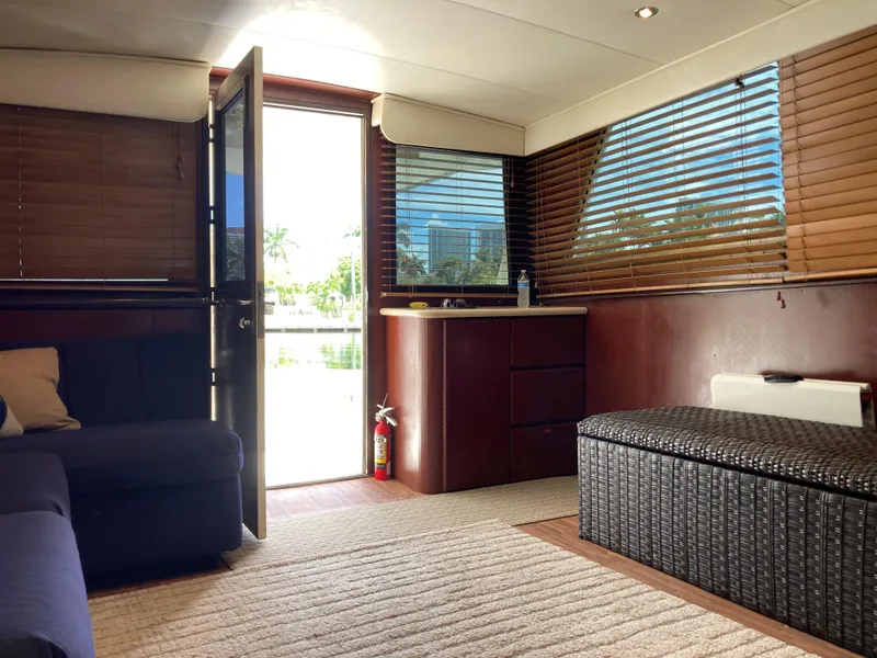 Slide: The Image of Interior of 1976 Hatteras 46 yacht with modern furnishings and open door view. - 39