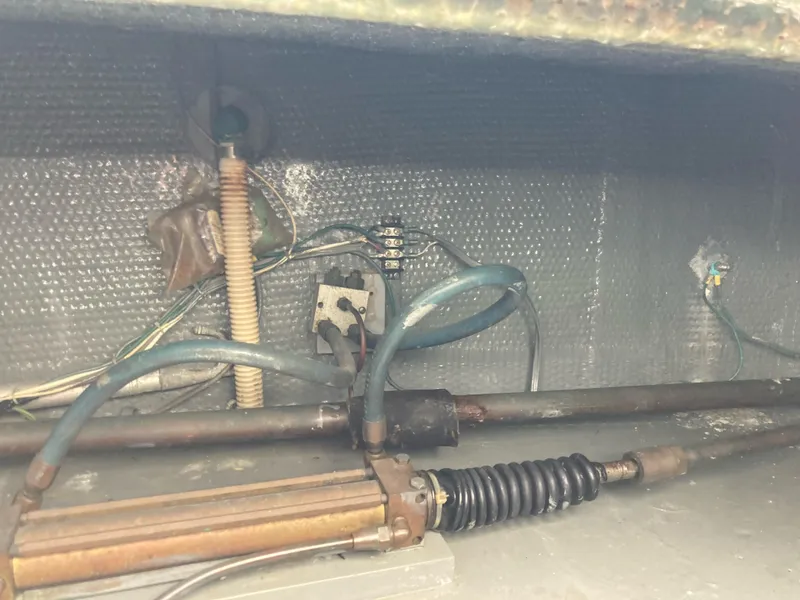 Slide: The Image of 1976 Hatteras 46 boat interior wiring and mechanical components. - 63